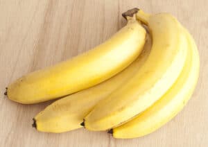 You should cut the bananas up before feeding them to your horse